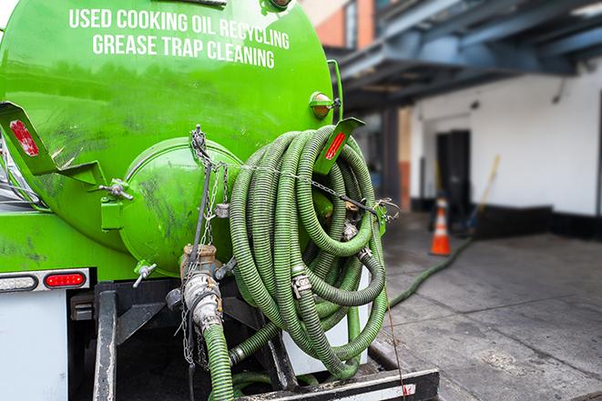 a grease trap pumping truck at a restaurant in Bedminster, NJ